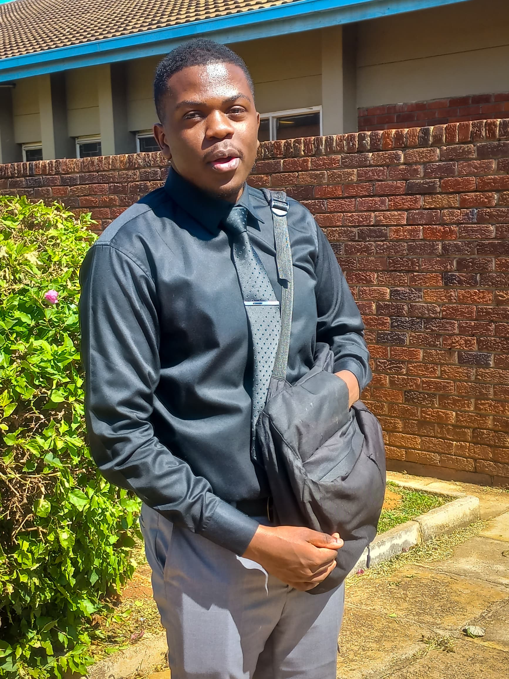 Professional portrait of Walter Kudzai Kamanga, a Flutter developer